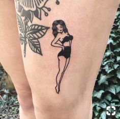 a woman with a tattoo on her leg