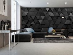 a modern living room with black and grey furniture