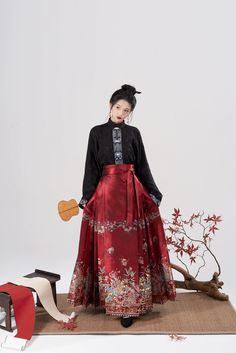 Ornately woven spider lilies & cherry blossoms upon a brocaded Mamian Qun 马面裙 (horse faced skirt) from the great Ming Dynasty! The horse faced skirt gets its name from its construction, similar to old war forts that were also called Mamian 马面 (horse face). The name stuck around due to its ease to wear while horseback riding. The construction of the mamian qun 马面裙 contains 2 large front and back panels showcasing the art on the skirt, and many trapezoidal pleats on the sides. This creates a very Traditional Pleated Skirt For Spring, Traditional Full Skirt For Spring, Traditional Long Skirt For Spring, Red Festive Skirt For Spring, Elegant Festival Skirt, Spider Lilies, Hanfu Men, Spider Lily, Modern Hanfu