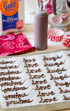 some type of chocolate cake sitting on top of a table next to other decorations and baking utensils