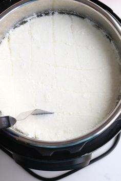 a pot filled with white powder on top of a stove