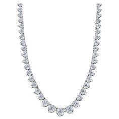 Indulge in the luxurious elegance of the bespoke Riviera Necklace, a true masterpiece boasting a remarkable Diamond weight of 20.00 Carats. The dazzling Round Brilliant Cut gems, with white glitzy natural diamonds G - I color and VS - SI1 clarity, are meticulously set in 18 Karat White Gold with a British Hallmark, exuding sophistication and glamour. Each stone is secured in a three claw setting with an open gallery, creating a mesmerising display of brilliance. Customizable with different Carat weights and available in 18 Karat Rose or Yellow Gold upon request. Culture history and additional information: Tennis bracelets and necklaces have been a symbol of elegance and sophistication in the world of jewelry for centuries. The trend of wearing diamond and gem-set tennis bracelets and neckl Riviera Necklace, Diamond Carat Size, Chris Evert, Diamond Tennis Necklace, Heritage Jewellery, White Gold Necklaces, Tennis Necklace, Modern Necklaces, Link Necklace