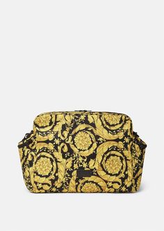 a black and yellow bag with an ornate pattern on it's front flaps