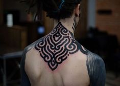 a man with a tattoo on his back