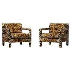 two leopard print chairs sitting next to each other