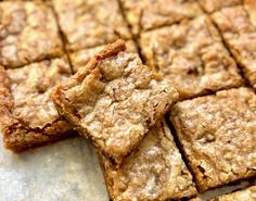 some brownies are stacked on top of each other and ready to be cut into squares