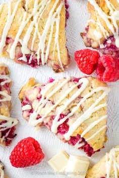 raspberry scones with white icing and fresh raspberries