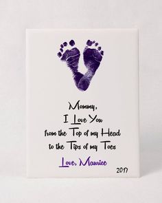 a ceramic tile with a hand and foot print on it's side that says mommy, i love you from the top of my head to the tips of my toes