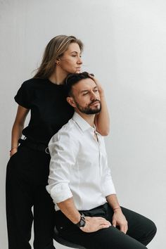 a man and woman sitting on top of each other