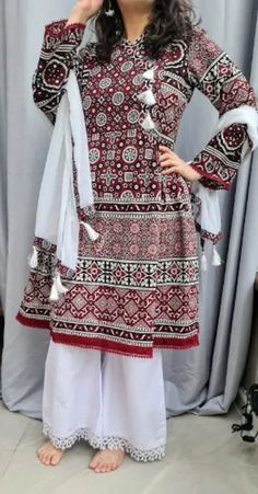 beautifully stitched PAKISTANI DRESS, Ajrak kameez peplum style and scarf this indian dress is for any occassion it is readymade and available in all sizes SMALL- CHEST 36 INCHES MEDIUM - CHEST40 INCHES LARGE - CHEST 44 INCHES XTRA LARGE- CHEST 48 INCHES  also available in kids sizes https://www.etsy.com/uk/listing/1165758638/kids-afghani-dress-girls-afghan-dress?ref=listings_manager_grid material: Cotton  all my dresses are high quality and are made with special care we are proud to be in the b Traditional White Cambric Dress, Traditional Shantoon Dress With Chikankari Embroidery, Bohemian Salwar Kameez For Eid And Traditional Ceremonies, Traditional Shantoon Lawn Suit For Navratri, Festive Kurta With Traditional Patterns In Tunic Shape, Festive Tunic Kurta With Traditional Patterns, Unstitched Anarkali Tunic Dress, Unstitched Mulmul Bohemian Sharara, Traditional Long Sleeve Mulmul Sharara