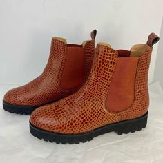 The Peggy Chelsea Boot From Andre Assous. This Bootie Features A Cognac ( Warm Light Brown)Color Snake Print Leather Upper And Chunky Midsole For A Touch Of Edge. Brand New Without Box, Excellent Condition, Never Worn Except To Be Tried On In Store, Some Light Handling On Sales Floor, No Stains Or Rips, See Photos Woman’s Size 7.5 Leather Upper Slip-On With Elastic Goring Cushioned Insole Round Toe Leather Lining Approx. 5.25" Shaft Height Approx. 8" Leg Opening 1.5" Molded Heel Synthetic Tracti Light Brown Color, Chelsea Boot, Printed Leather, Snake Print, Warm Light, Brown Color, Cognac, Bootie, Light Brown