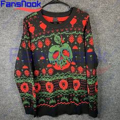 an ugly sweater hanging on a hanger