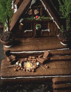 a gingerbread house made to look like it has been built into the ground