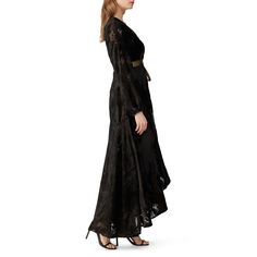 Black and gold velvet (80% Viscose, 20% Nylon). Gown. Long sleeves. V-neckline. Wrap dress. Fully lined. 51" from shoulder to front hemline, 60" from shoulder to back hemline. Imported. Flowy Black Velvet Dress, Luxury Long Sleeve Black Victorian Dress, Black Velvet Dress Sheer Sleeves, Black Velvet Embroidered Dress, Luxury Velvet Long-sleeve Outerwear, Gold Velvet, Rent The Runway, Closet Designs, Vintage Finds