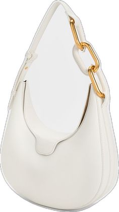 a white purse with a gold chain on the handle