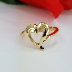 14k Gold Ring with a heart in the center. For only $289.00. Purchase comes with a gift box included. Ring size is adjustable, please note the size in the personalization section of checkout. Mothers Day Rings, Gold Heart Ring, Personalized Rings, 14k Gold Ring, Gold Heart, Heart Of Gold, Gold Bands, A Heart, Gold Ring