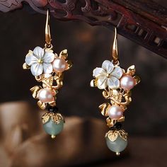 Item Code: 2086550831166Item Type: EarringsGender : WomenMaterial: Shell Flower, Pearl, Gold Plated Ear HookStyle: Casual, Ethnic, RetroShape/pattern: FlowerApplicable Occasions:Party, Engagement Anniversary ,Vacation Gift,Traveling.Length: 5.10 cm/ 2.01 " Jade Earrings, Beaded Dangle Earrings, Stunning Earrings, Floral Earrings, Flower Earrings, Vintage Earrings, Earrings Handmade, Fashion Earrings, Faux Pearl