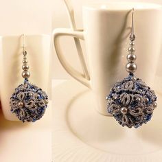 two pictures of the same pair of earrings on a coffee cup and in front of a mug