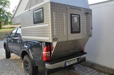 a truck with a camper attached to the back