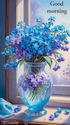 a vase filled with blue flowers on top of a table