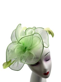 A Brand New light green Colour Fascinator With cloth fabric forming a beautiful layered flower with a burst of feathers, thus making a beautifully crafted fascinator. Made up of cloth fabric and feathers The length of the fascintor is approximately 20cm and its width at the widest point is 19cm. This Fascinator comes in with a light green colour headband and a metal clip as an attachment. These are removable and can be used according to your need. This allows you to wear the fascinator at differ Summer Race Day Feather Hair Accessories, Elegant Feathered Headband For Summer, Green Formal Headpiece For Kentucky Derby, Spring Wedding Feather Headband, Spring Wedding Headband With Feathers, Summer Feather Fascinator For Garden Party, Adjustable Green Summer Fascinator, Spring Adjustable Green Fascinator, Elegant Green Fascinator For Kentucky Derby