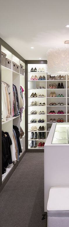 the inside of a shoe store with lots of shoes