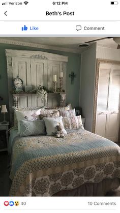 a bed with lots of pillows on top of it