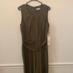 Calvin Klein Womens Jumpsuit / Olive Green / Size 14 / Rayon , Polyester , Spandex . Sleeveless/ Very Comfy . Brand Nwt’s Spring Chic Calvin Klein Jumpsuits And Rompers, Calvin Klein Summer Workwear Jumpsuits And Rompers, Calvin Klein Summer Jumpsuits And Rompers For Work, Chic Calvin Klein Jumpsuits And Rompers For Summer, Chic Calvin Klein Summer Jumpsuits And Rompers, Calvin Klein Fitted Workwear Jumpsuits And Rompers, Calvin Klein Fitted Jumpsuits For Work, Calvin Klein Fitted Jumpsuits And Rompers For Work, Chic Calvin Klein Workwear Jumpsuits