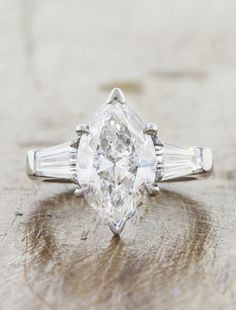 an oval and baguette cut diamond engagement ring