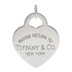 This is an authentic TIFFANY Sterling Silver Extra Large Return to Tiffany Heart Tag Charm. The charm is crafted of sterling silver and features the Return to Tiffany logo engraved along the front of a heart motif. Heart Motif