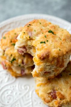 two cheesy biscuits on a white plate