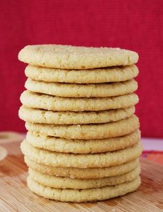 a stack of cookies sitting on top of a wooden cutting board