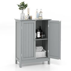 a gray cabinet with some bottles and soaps on the top shelf next to it