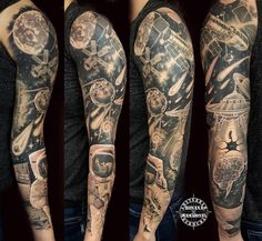 the arm is covered in tattoos and has many different things on it, including an astronaut's helmet