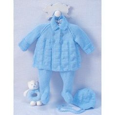 a blue knitted baby's outfit and teddy bear