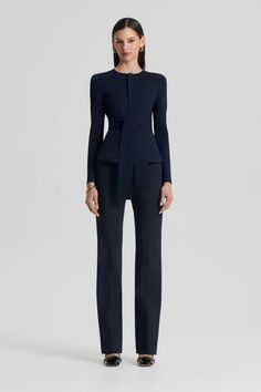 The Curved Hem Jacket in Navy closes at the front with a zip and includes a separate belt to be worn high around the waist. The Curved Hem kicks up and breaks the line across the hip. This jacket is very popular because of its simplicity. The shoulder line, slim long sleeve, neckline, and peplum all serve to streamline and elongate the body. Navy Blue Suit Outfits Women, Chic Fitted Outerwear With Belted Cuffs, Tailored Long Sleeve Outerwear With Belt, Chic Fitted Outerwear With Belt Loops, Fitted Long Sleeve Outerwear With Self Belt, Fitted Long Sleeve Outerwear With Belt Loops, Long Sleeve Outerwear For Work With Self Belt, Fitted Long Sleeve Blazer With Belt, Fitted Fall Outerwear With Self Belt