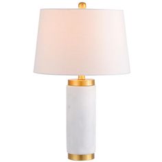 Marble has long been prized for its durability and beauty, and in this classic column base, both shine. Capped in brass accents and a slightly tapered drum shade, the contemporary styling of this column lamp would be even more perfect positioned in a pair. Finished with a silk-wrapped cord and brass finial, this piece JONATHAN Y Classic Column, Traditional Table Lamps, Column Base, Marble Table Lamp, Globe Decor, Nightstand Lamp, Table Lamp Shades, Contemporary Table Lamps, Lamp For Bedroom