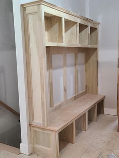 a room with unfinished furniture in the process of being built and put together for storage