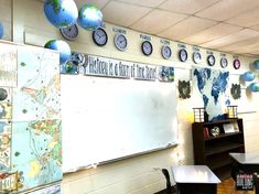 there are many clocks on the wall in this classroom