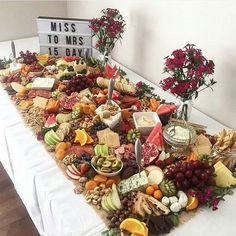 a long table covered in lots of different types of food