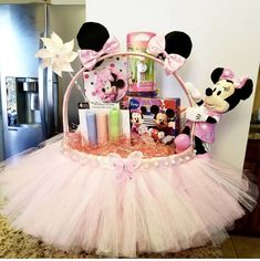 a minnie mouse gift basket with pink tutu and accessories