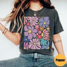 "Boho Flower Tshirt | Floral Minimalist Shirt | Abstract Botanical Shirt | Cottagecore Tee | Wild Flower Shirt | Vintage Floral Tee Matching Sweatshirt: https://printworkshopcompany.etsy.com/listing/1688256516/boho-flower-shirt-wildflower-sweatshirt ** HOW TO ORDER 1. Check our photos for sizing and color options.  2. Select your size and color from the drop-down menus.  3. Click \"ADD TO CART\" to add the shirt to your cart. 4. Click \"PROCEED TO CHECKOUT\" to purchase your shirt. ** VIP Email Trendy Crew Neck Shirt With Plant Print, Black Graphic Tee With Floral Print, Black Floral Print Graphic Tee Shirt, Trendy Multicolor Floral Print T-shirt, Black Graphic Tee Shirt With Floral Print, Trendy Short Sleeve Shirt With Plant Print, Trendy Floral Print Relaxed Fit T-shirt, Multicolor Graphic Tee With Floral Print, Multicolor Floral Graphic Tee Shirt