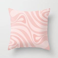 a pink pillow with wavy lines on it