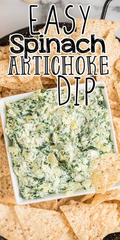 easy spinach artichoke dip in a bowl surrounded by tortilla chips