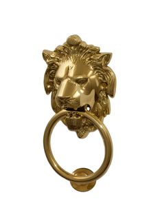 a gold lion head door knocket with a ring on it's side, against a white background