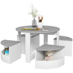 the table and chairs are all white with storage compartments underneath them for children's toys