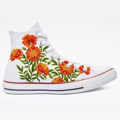 These shoes have been customized with Marigold flowers on the outsides of the shoes. These are White Converse high top Sneakers for Men or Women.  We buy each pair of shoes BRAND NEW from the Converse retail store. Each pair is made to order, please make sure you put in the correct shoe size before you check out. The ink is permanent and will never come off, fade away, or peel off. Made in the USA. This price includes everything: shoes, artwork, and shipping. Thanks for stopping by our Etsy shop! Please message us with any questions! Please know your size before ordering. Converse run 1 size large for men. Sizes listed are in US sizing scale. Please note that colors of actual item may slightly differ from what you see on your screen due to differences in computer monitor settings. Note: Bl White High-top Sneakers With Floral Print, Custom Vans Slip On, Flower Converse, Shoes Artwork, White Chuck Taylors, Vans Slip On Shoes, White Chucks, White High Top Converse, Converse High Top