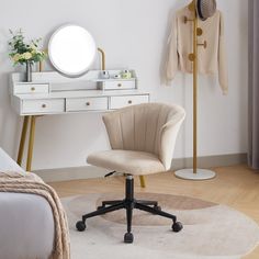 a bedroom with a desk, mirror and chair