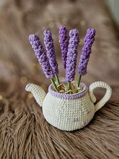 crocheted lavender flowers in a tea pot