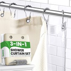 there is a shower curtain set with 3 in 1 items on the shelf next to it